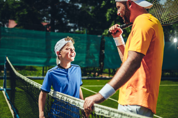 istock Happy male talking with kid on court 1141650706