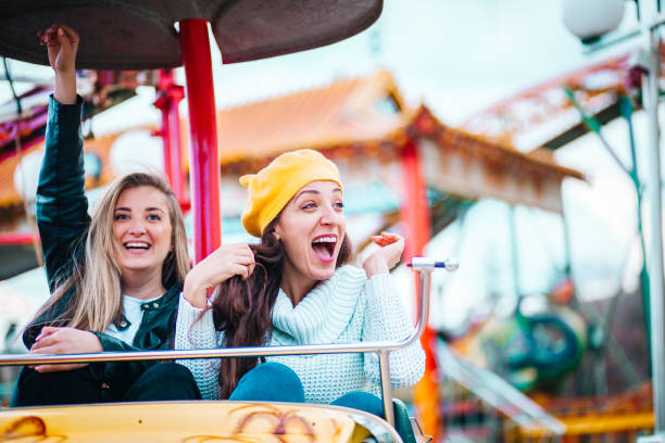 istock Two friends at amusement park 1141655050