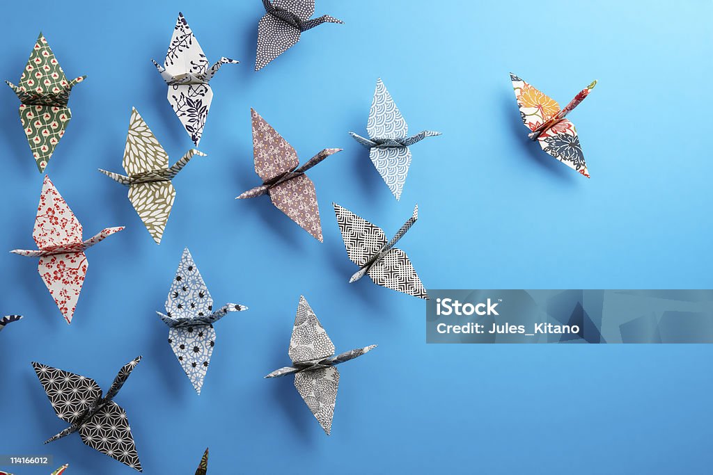 Origami birds Colorful origami birds flying to the light. Origami Stock Photo