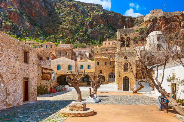 Monemvasia houses and church, Peloponnese, Greece Monemvasia, Greece panorama with old houses and Elkomenos Christos church in ancient town, Peloponnese, Greece peninsula stock pictures, royalty-free photos & images
