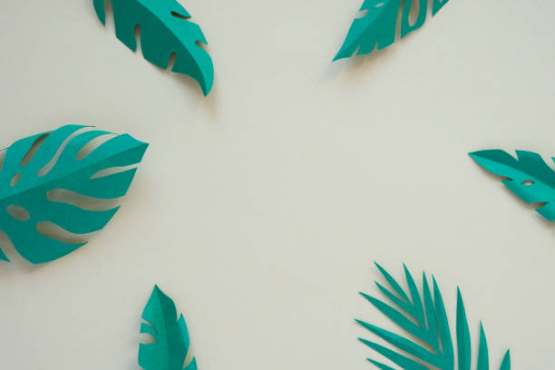 istock tropical leaves cut from paper. muted colors 1141660728