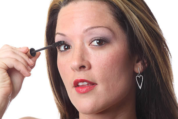 istock Beautiful woman applying eye makeup 114166373