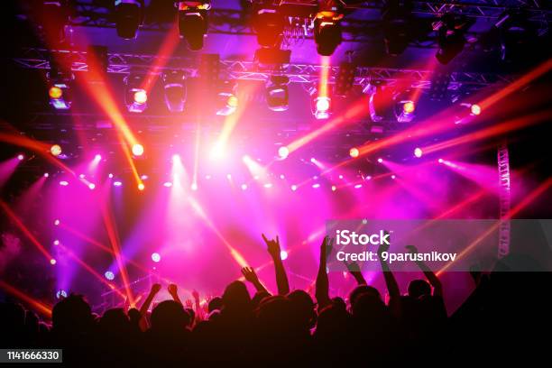 People Crowd On Concert Purple Light From Stage Stock Photo - Download Image Now - Blue, Music, Purple