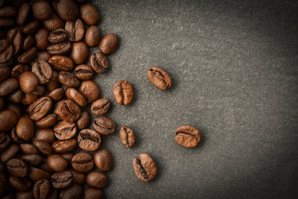 istock Coffee beans roasted on dark background 1141666396