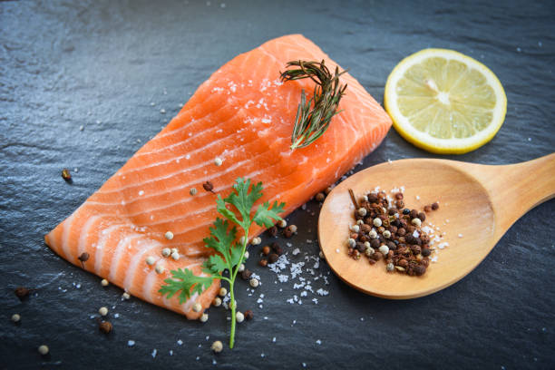 istock Fresh salmon fillet on dark background 1141666445