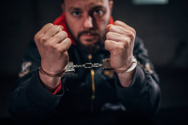 istock Man criminal wearing handcuffs 1141666734