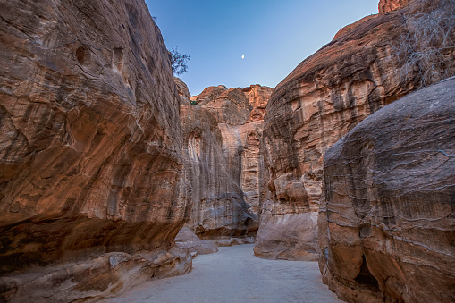 narrow passage in the canyon al-Siq in the mountains leading to the ancient Nabatian city of Petra