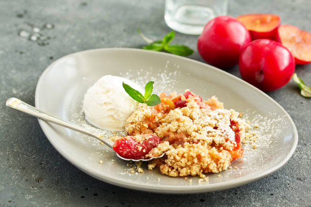 istock Plum crumble with almond crumb and ice cream. 1141671792