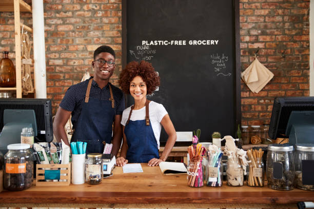 portrait of male and female owners of sustainable plastic free grocery store - male african descent africa ethnic imagens e fotografias de stock
