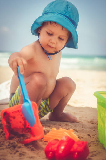 istock Happy little boy playing on the beach 1141672847
