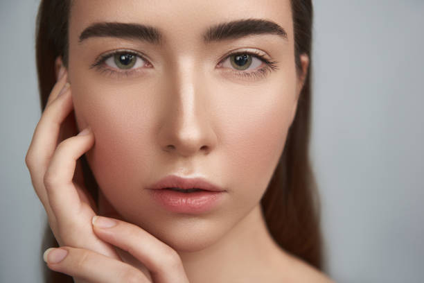 istock Pensive natural young lady against grey background 1141675179