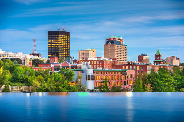 Manchester, New Hampshire, USA Skyline on the Merrimack River Manchester, New Hampshire, USA Skyline on the Merrimack River at dusk. new hampshire stock pictures, royalty-free photos & images