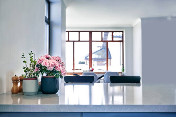 istock View on kitchen and dining room with wooden table and big window 1141677744