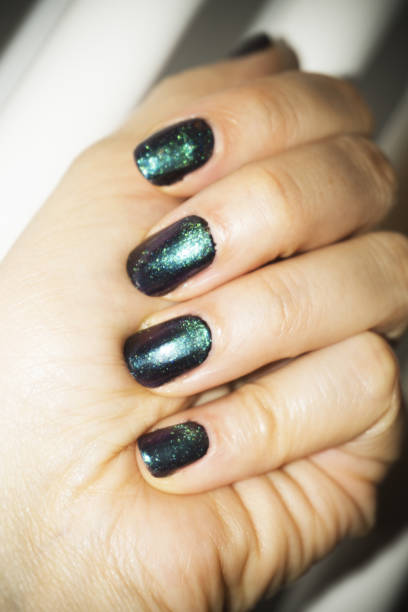 istock Woman hand manicure green colour 1141678355