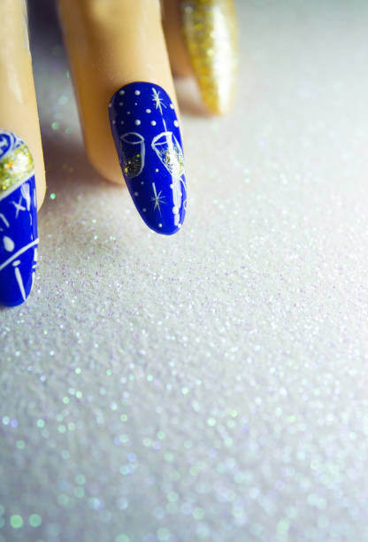 istock Permanent gel nails with new year decoration.  Bright background 1141678499