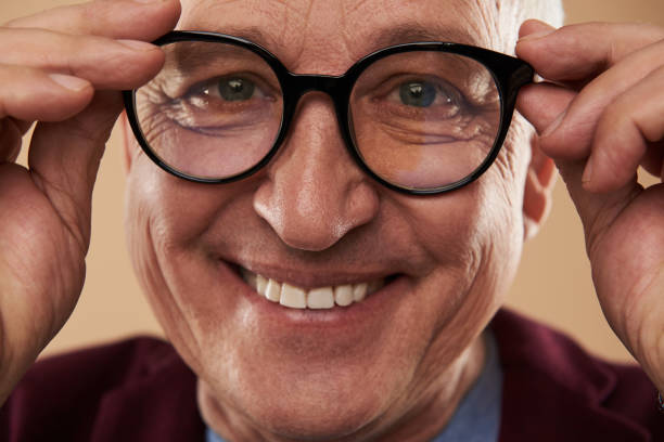 istock Happy man smiling with his white teeth while wearing glasses 1141679671