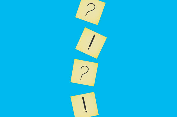 istock Scattered square paper sheets with handwritten question and exclamation marks on blue table. Top view. Business concept. Copy space 1141680164