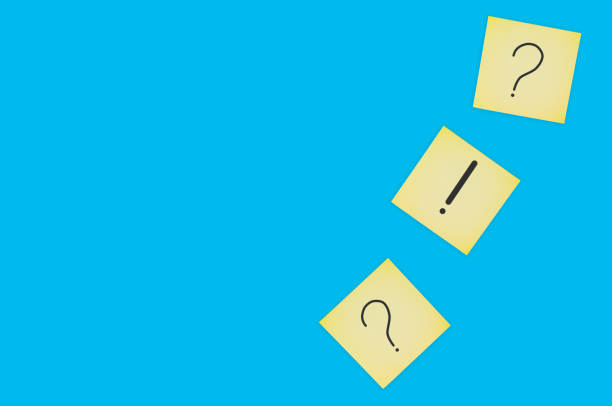 istock Scattered square paper sheets with handwritten question and exclamation marks on blue table. Top view. Business concept. Copy space 1141680166