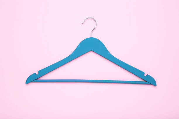 istock Turquoise hanger on pink background 1141680286