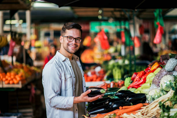 istock Young man shopping fresh groceries. 1141680671