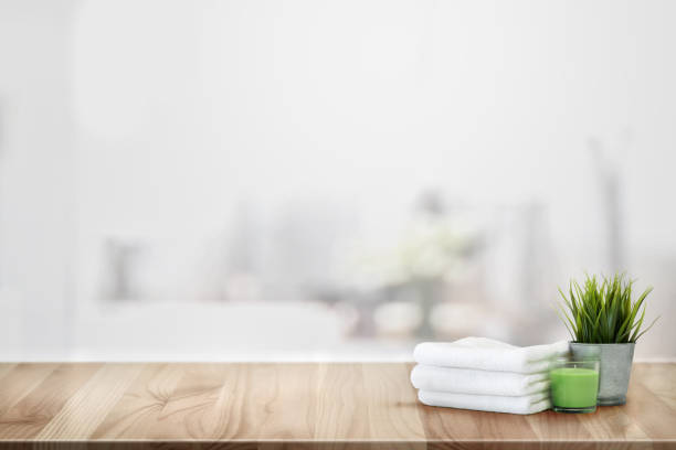 istock Towels and spa accessory on wood counter table 1141681657