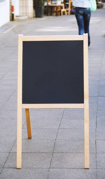 istock empty customer stopper blackboard sign standing on sidewalk 1141683755