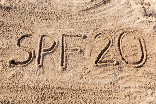 istock Sun protect factor twenty concept. SPF 20 word written on the beach 1141683942
