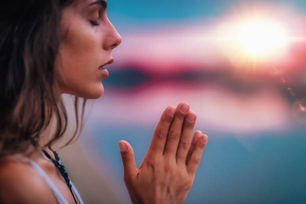 istock Meditating. Close Up Female Hands Prayer 1141685872