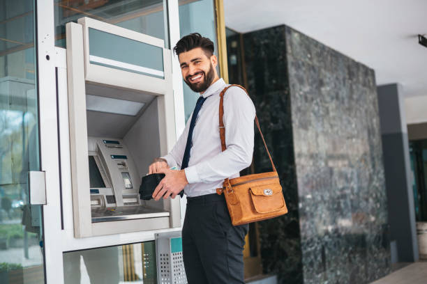 istock Businessman using card at an ATM 1141687064