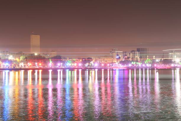 istock city ​​lights and reflection on the sea 1141687113