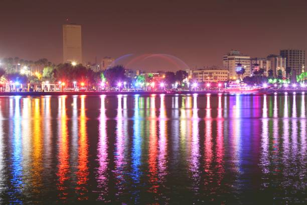 istock city ​​lights and reflection on the sea 1141687117