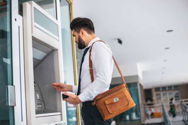istock Businessman using card at an ATM 1141687310