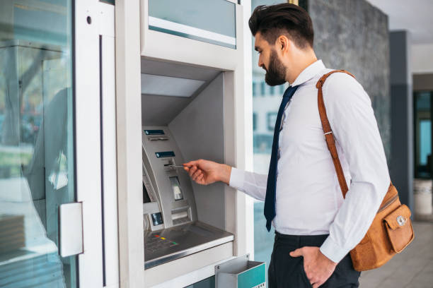 istock Businessman using card at an ATM 1141687486