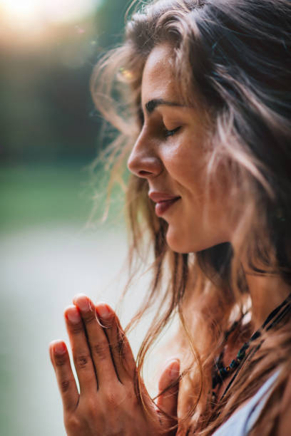 istock Meditating. Close Up Female Hands Prayer 1141687498