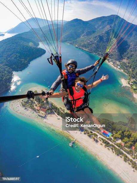 Tandem Jump In Paragliding Stock Photo - Download Image Now - Travel, Adventure, Paragliding