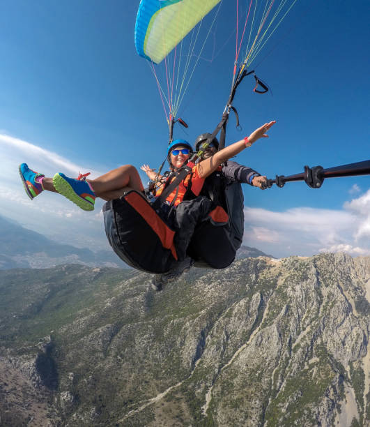 istock Tandem jump in paragliding. 1141688920