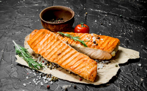 istock Grilled salmon fillet with rosemary branches. 1141689020