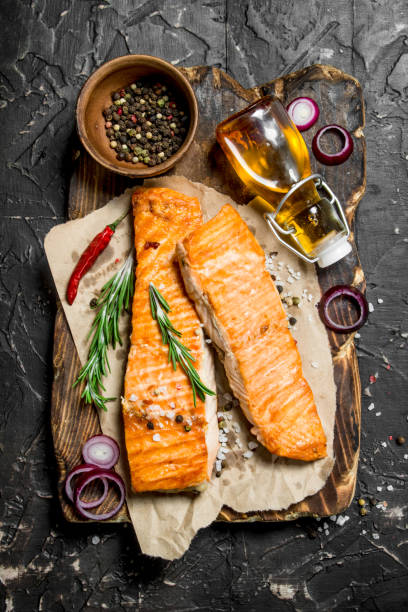 istock Grilled salmon fillet with spices and herbs. 1141689053