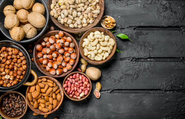 istock Assortment of different nuts in bowls. 1141689122