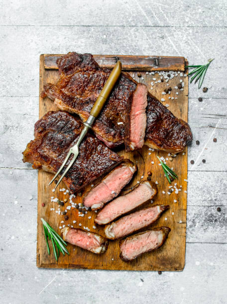 istock Grilled beef steak with rosemary and spices. 1141690296
