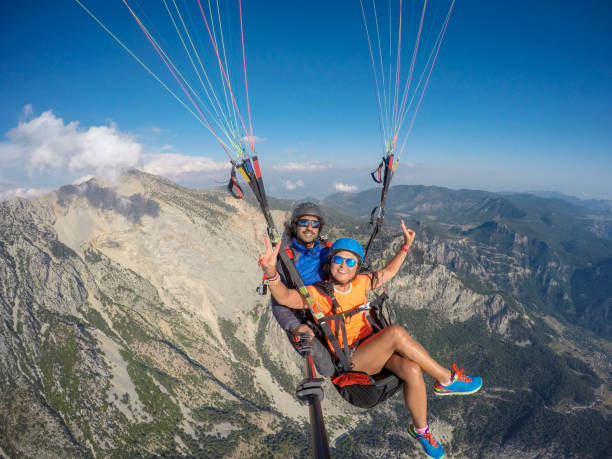 istock Tandem jump in paragliding. 1141690365