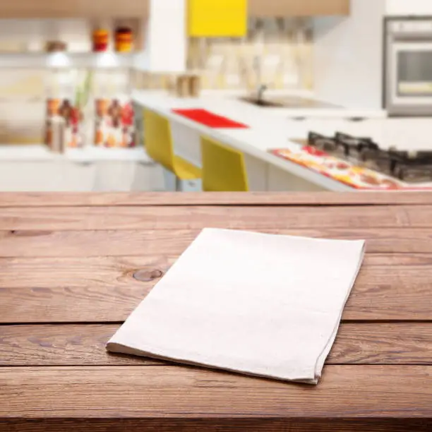 Photo of Tablecloth on the table and kitchen interior blurred background