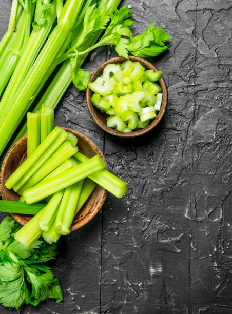 istock Pieces of celery in a wooden bowl. 1141690977
