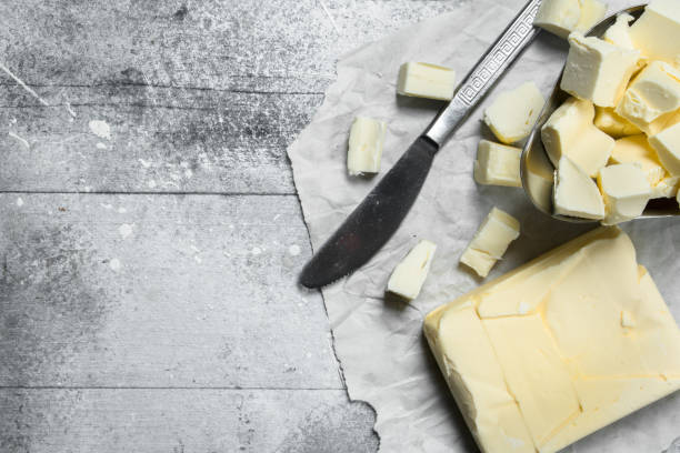 istock Butter in a bowl with a knife. 1141691973