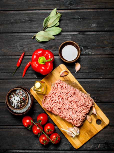 istock Raw minced meat with vegetables and spices . 1141692081