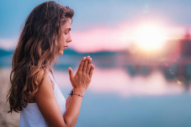 istock Meditating. Close Up Female Hands Prayer 1141692128