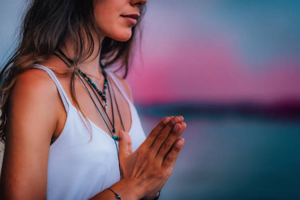 meditating. close up female hands prayer - sky human hand water white imagens e fotografias de stock