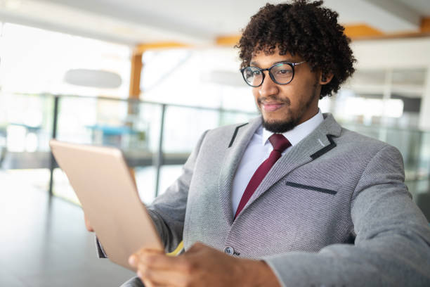 istock African american businnesman using tablet close up 1141692628
