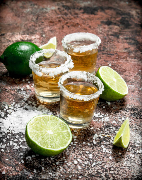 istock Tequila in a shot glass with salt and sliced lime. 1141692757