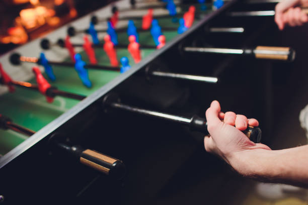 People Playing Enjoying Foosball Table Soccer Game Recreation Leisure.